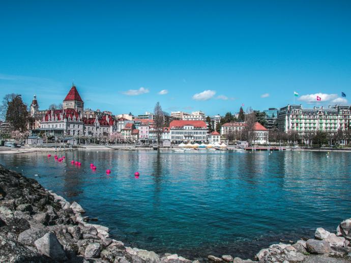 a body of water with a bunch of buildings in the background